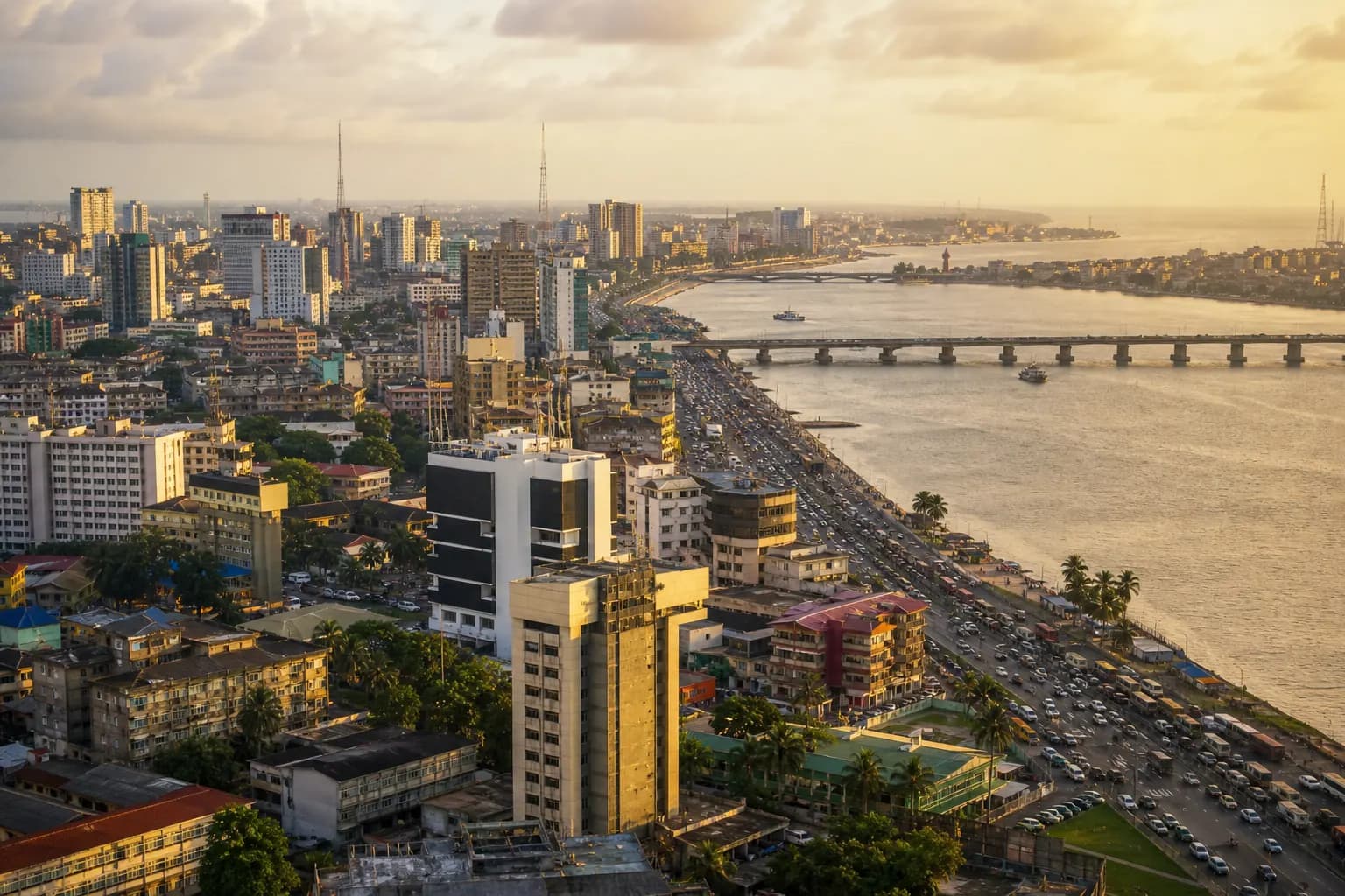 Lagos-style African city skyline along the waterfront at golden hour