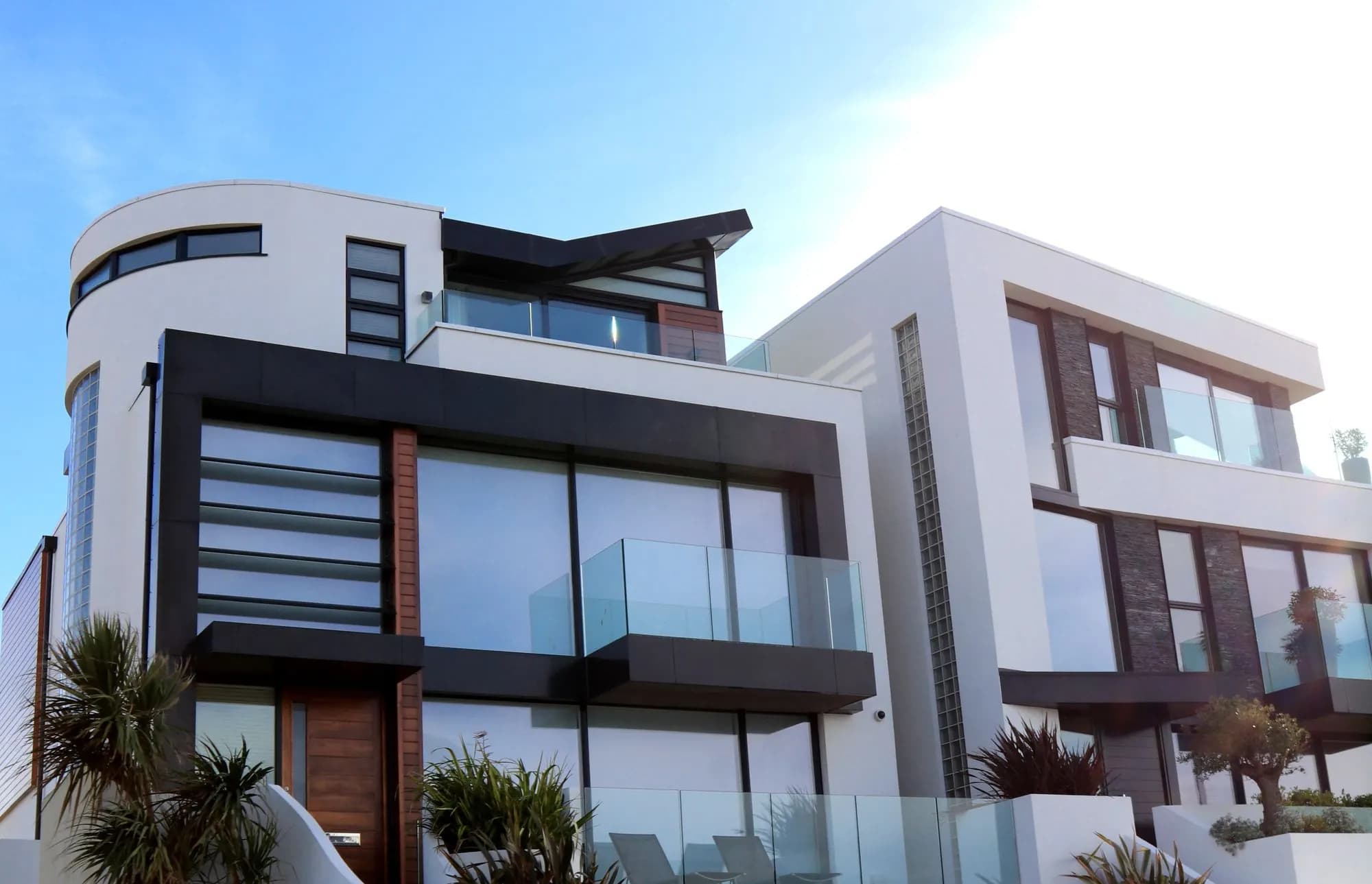 Modern luxury residences with warm materials and glass